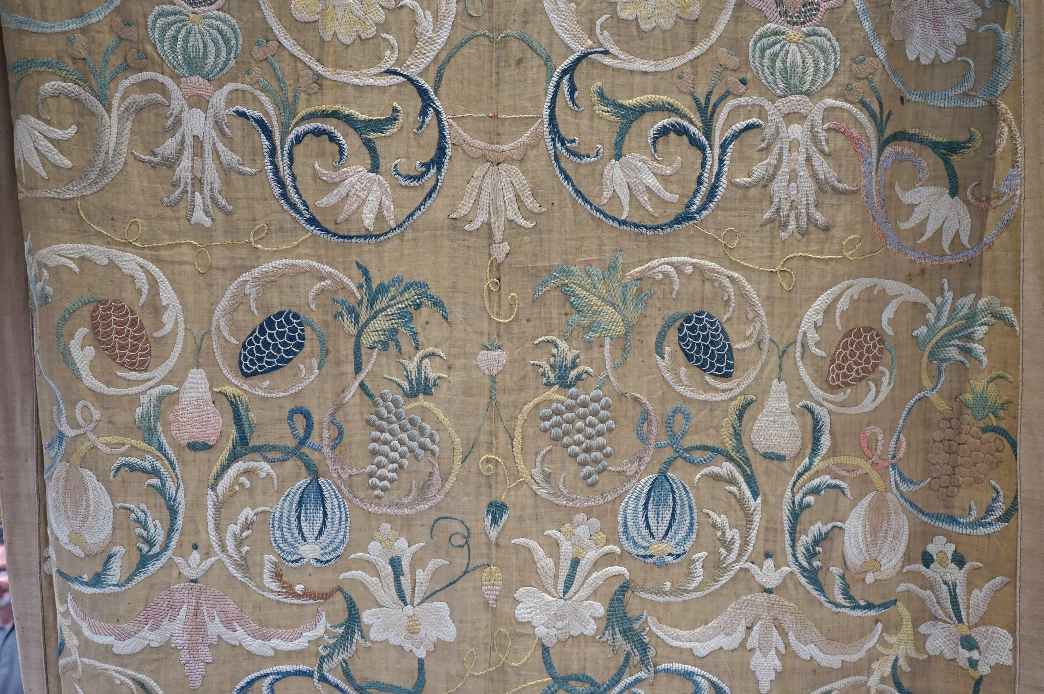 A large pair and one smaller panel of late 18th century Italian silk floss hand embroidered panels, possibly from Florence or Venice, both known for floss embroidery. Thought to be originally sacristy hangings. Elaborate